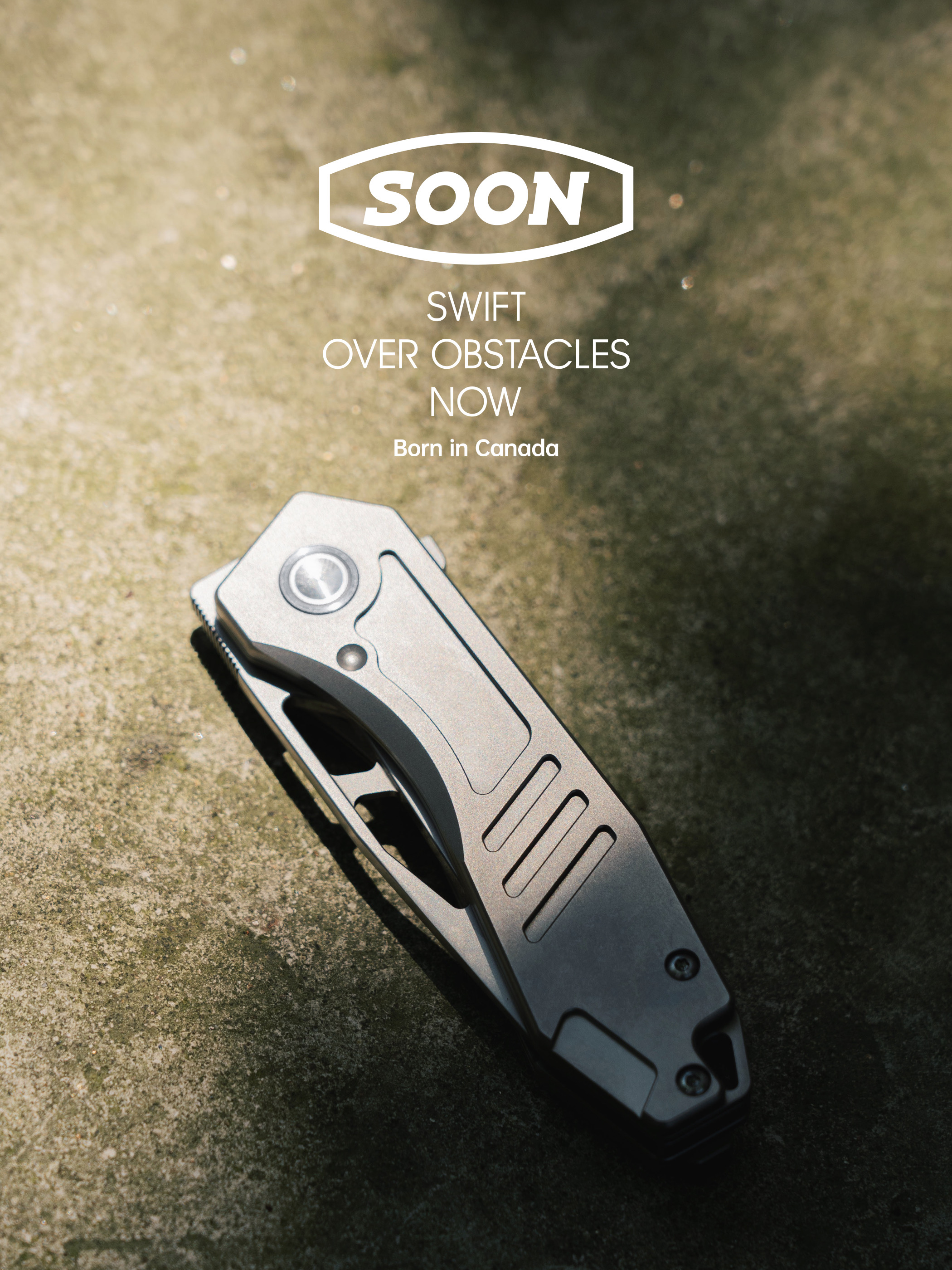 SOON titanium knife on concrete